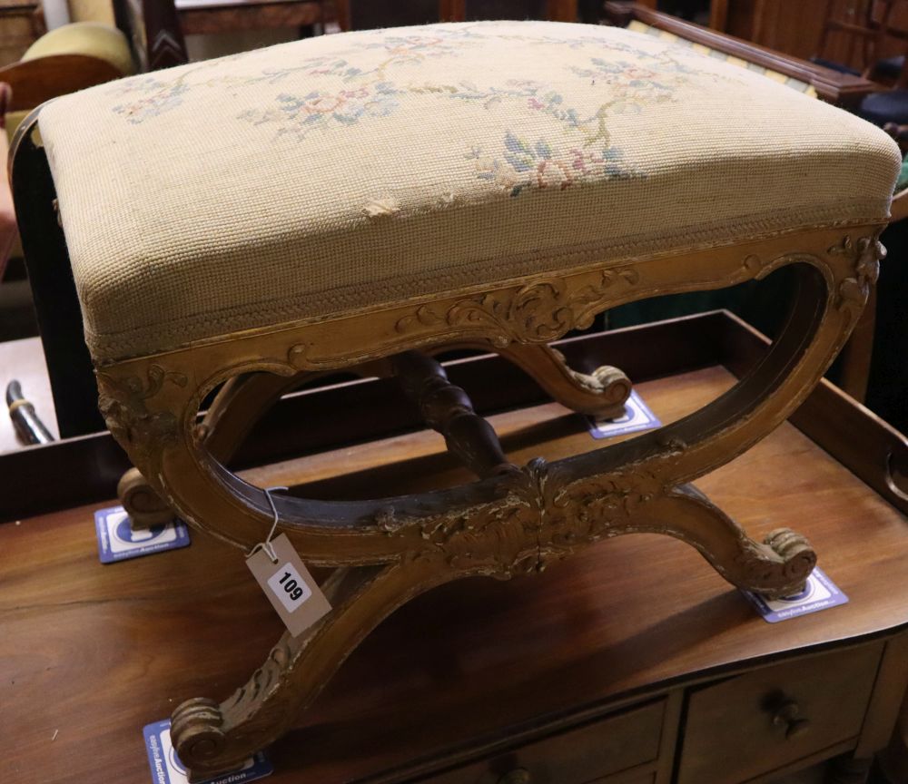 A 19th century giltwood X frame dressing stool, width 60cm, depth 40cm, height 46cm